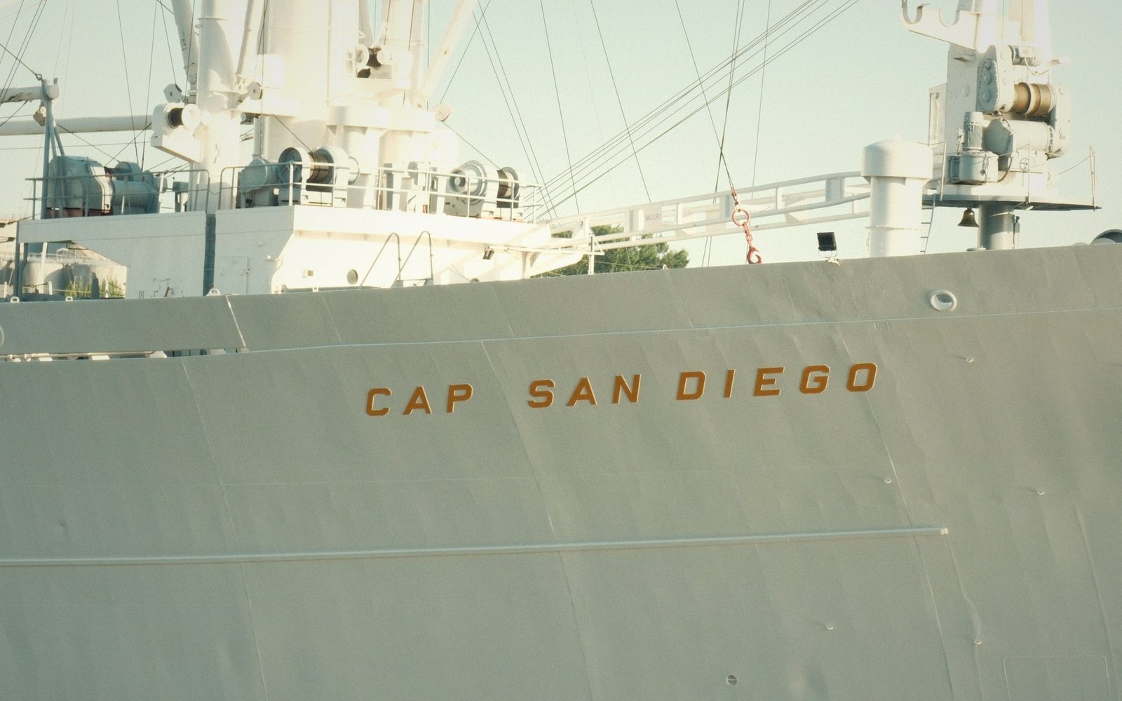 Bow of the cargo ship Cap San Diego showing its name in orange letters